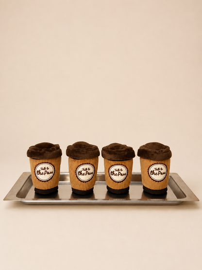 Puppuccino coffee cup plush dog toys on a neutral background
